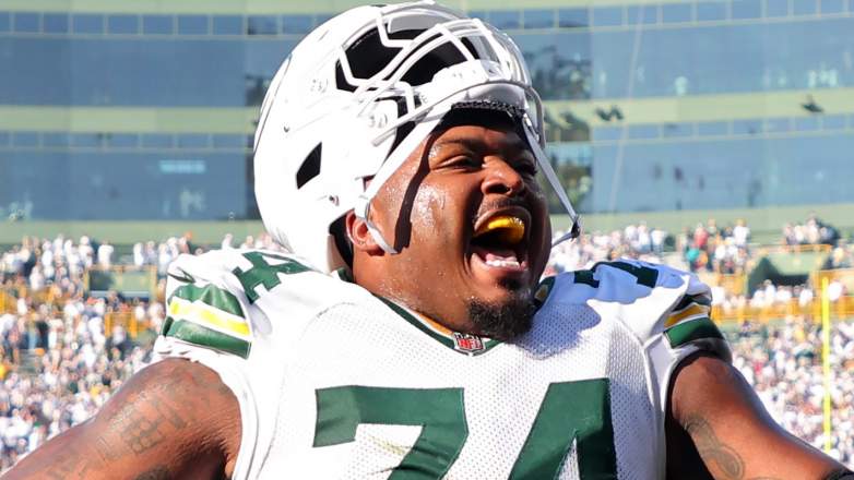 GREEN BAY, WISCONSIN - OCTOBER 20: Elgton Jenkins #74 of the Green Bay Packers celebrates after beating the Houston Texans 24-22 at Lambeau Field on October 20, 2024 in Green Bay, Wisconsin.