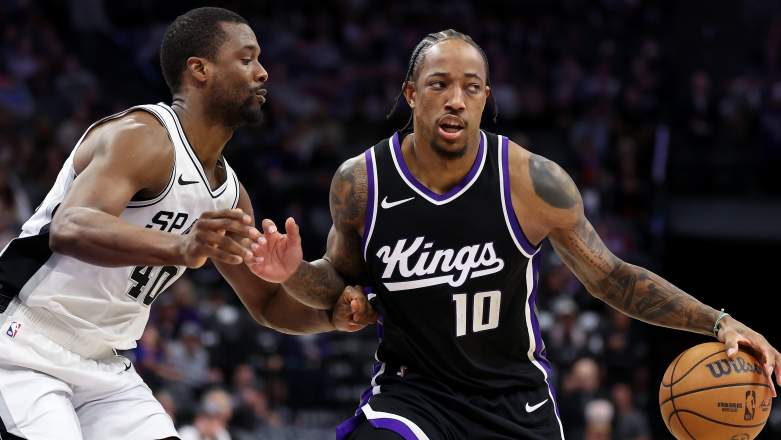 Sacramento Kings forward DeMar DeRozan dribbles against San Antonio Spurs forward Harrison Barnes