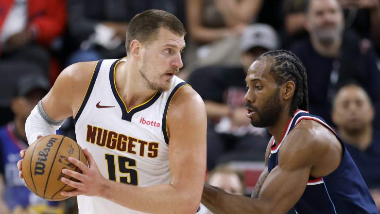 Denver Nuggets center Nikola Jokic guarded by Los Angeles Clippers forward Kawhi Leonard