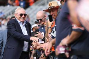 CHICAGO, ILLINOIS - SEPTEMBER 21: Owner Jerry Jones of the Dallas Cowboys shakes hand with fans before the game against the Chicago Bears at Soldier Field on September 21, 2025 in Chicago, Illinois. (Photo by Michael Reaves/Getty Images)