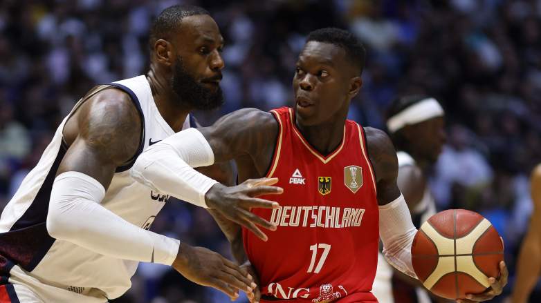 German guard Dennis Schroder drives against American forward LeBron James