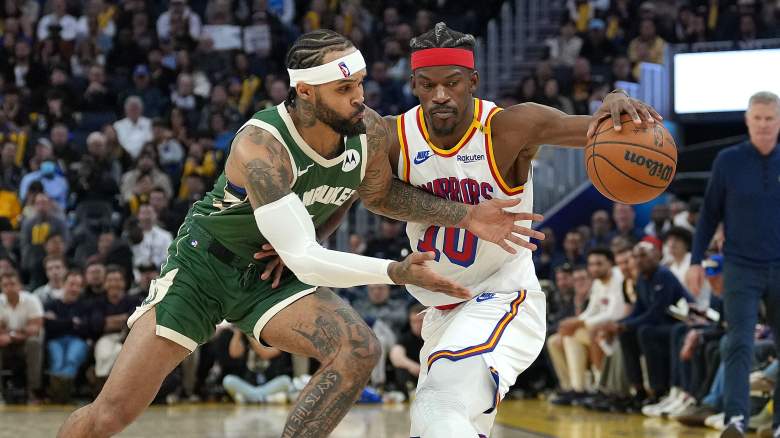 Golden State Warriors forward Jimmy Butler is defended by Milwaukee Bucks guard Gary Trent Jr.