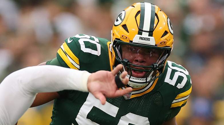 GREEN BAY, WISCONSIN - OCTOBER 12: Zach Tom #50 of the Green Bay Packers defends Trey Hendrickson #91 of the Cincinnati Bengals at Lambeau Field on October 12, 2025 in Green Bay, Wisconsin. (Photo by Michael Reaves/Getty Images)