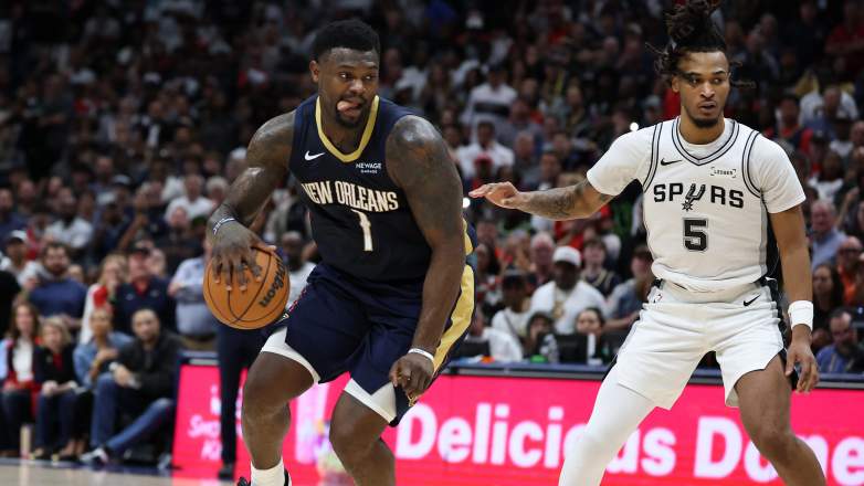 New Orleans Pelicans forward Zion Williamson dribbles past San Antonio Spurs guard Stephon Castle