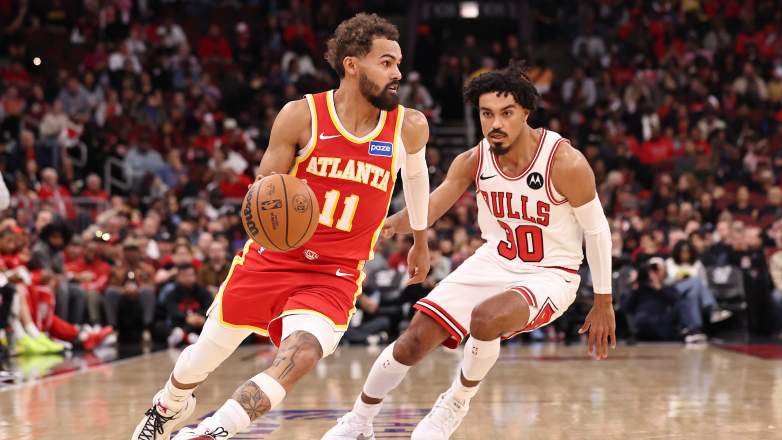 Atlanta Hawks point guard Trae Young dribbles past Chicago Bulls guard Tre Jones