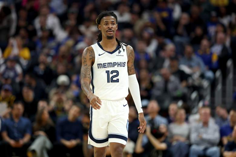 Ja Morant walks down the court during an NBA game.