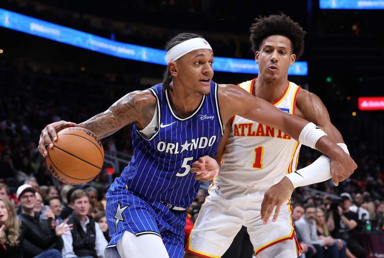 Paolo Banchero drives to the basket in an NBA game.