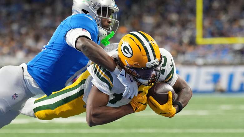 DETROIT, MICHIGAN - NOVEMBER 27: Dontayvion Wicks #13 of the Green Bay Packers scores a touchdown against Terrion Arnold #6 of the Detroit Lions during the third quarter at Ford Field on November 27, 2025 in Detroit, Michigan. (Photo by Nic Antaya/Getty Images)