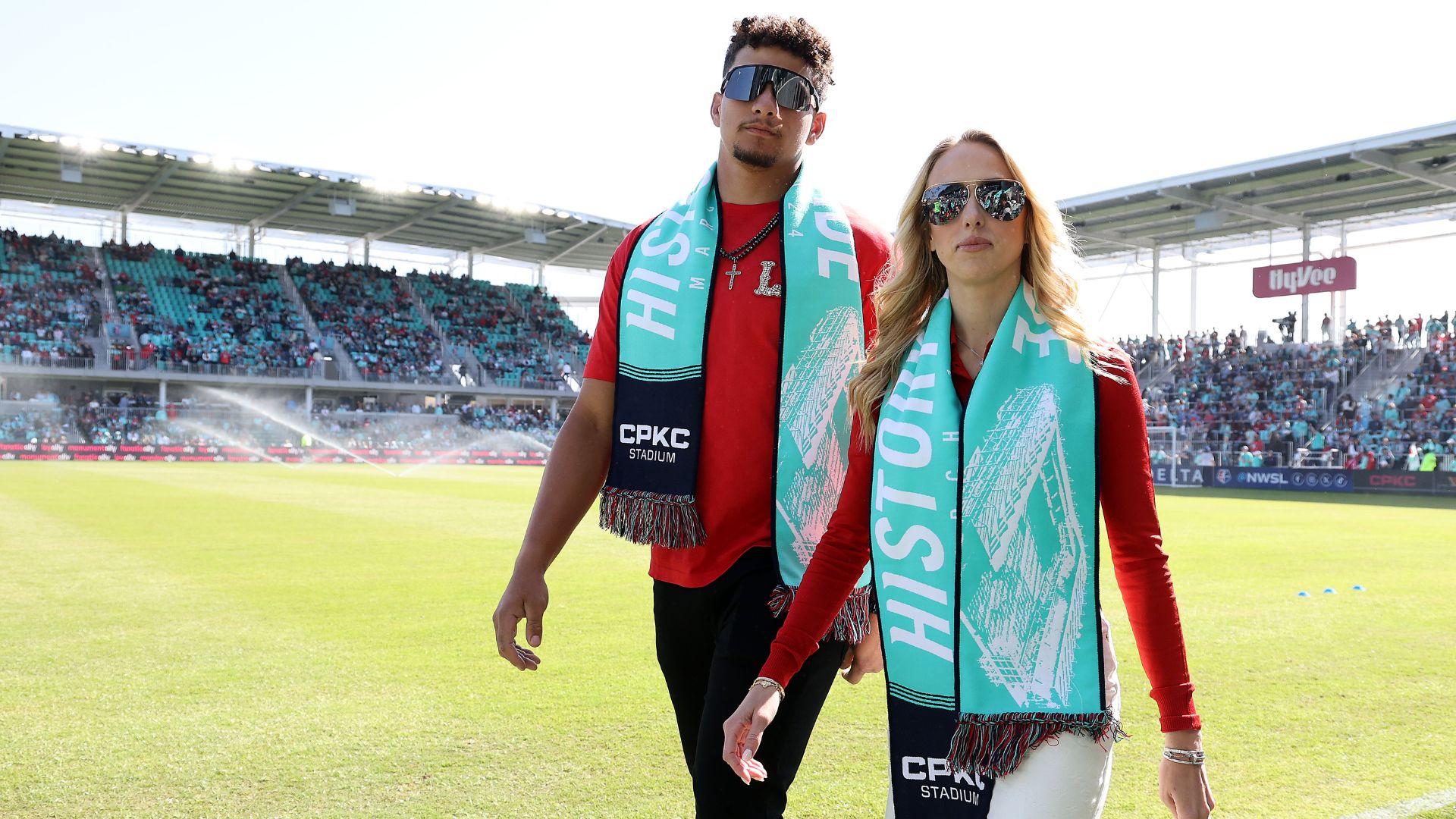 Co-owners Brittany and Patrick Mahomes walk on the field prior to the match between the Portland Thorns FC and the Kansas City Current at CPKC Stadium, the first stadium purpose-bult for women's soccer, on March 16, 2024 in Kansas City, Missouri