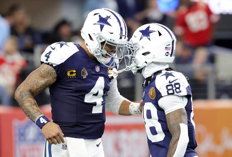 Dak Prescott #4 of the Dallas Cowboys celebrates a touchdown with CeeDee Lamb #88 during a game against the Kansas City Chiefs at AT&T Stadium on November 27, 2025 in Arlington, Texas. The Cowboys defeated the Chiefs 31-28.