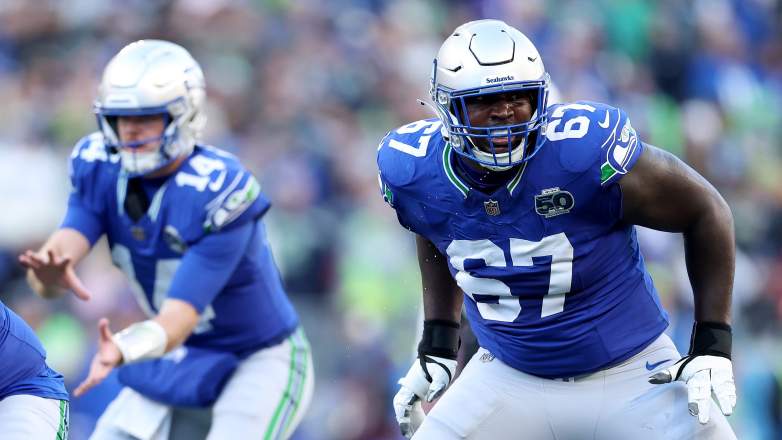 Seattle Seahawks QB Sam Darnold and LT Charles Cross