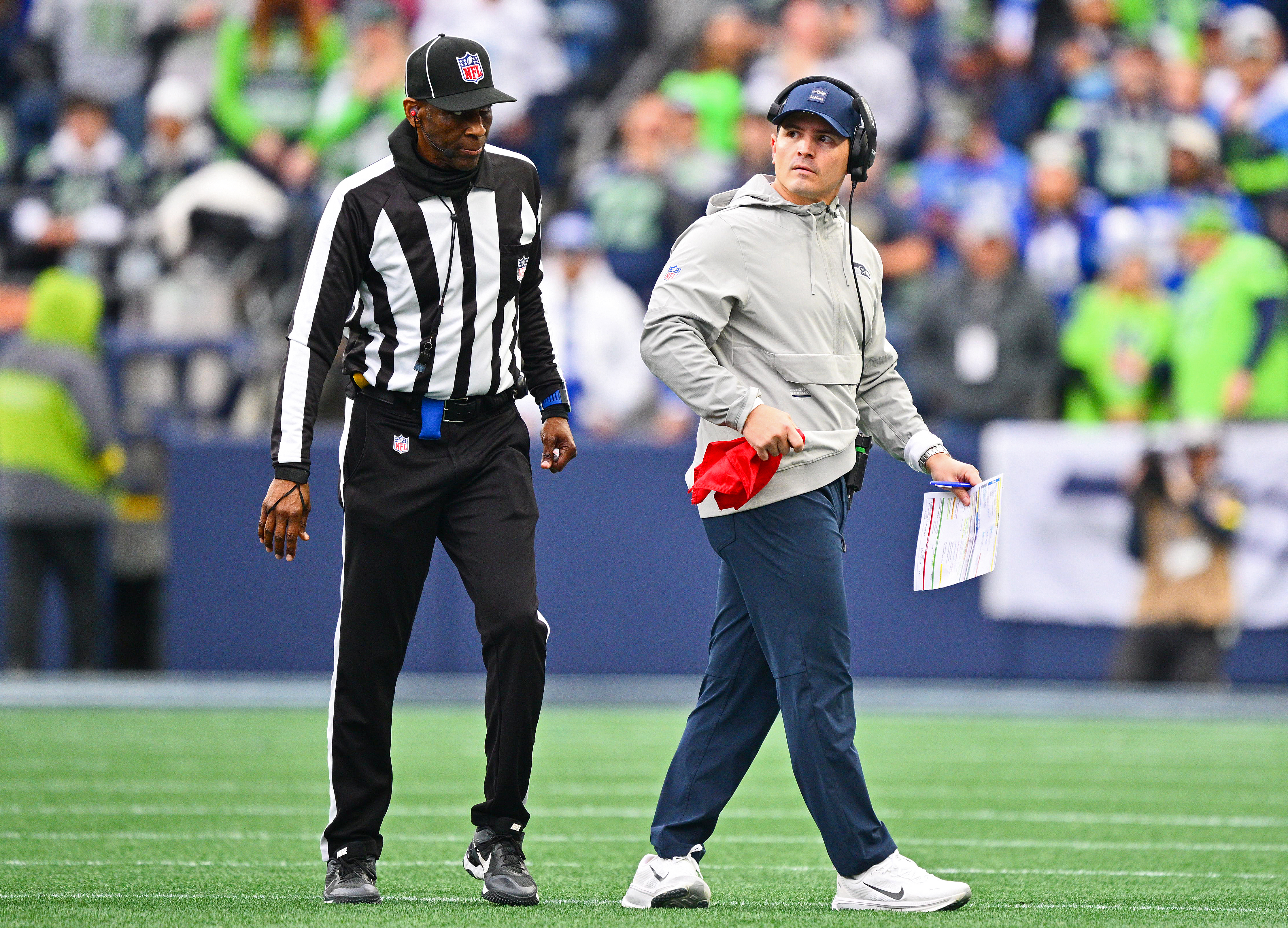 Mike Macdonald looks on during an NFL game.