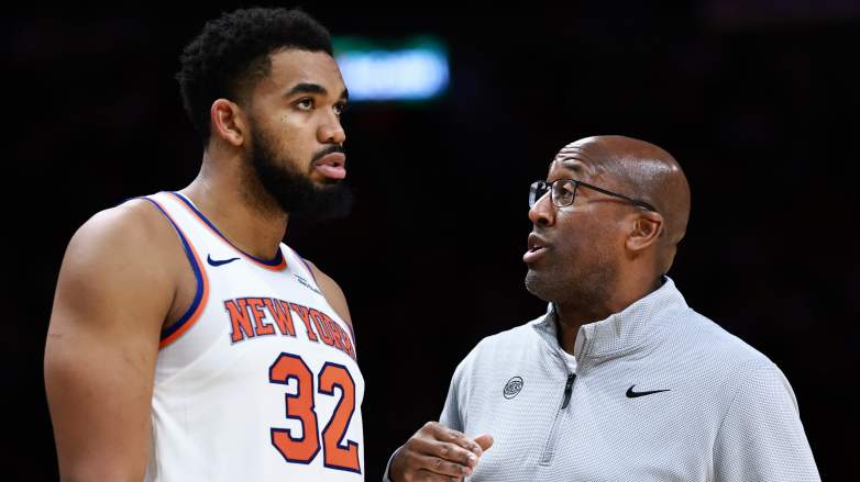 Karl-Anthony Towns #32 of the New York Knicks speaks with head coach Mike Brown