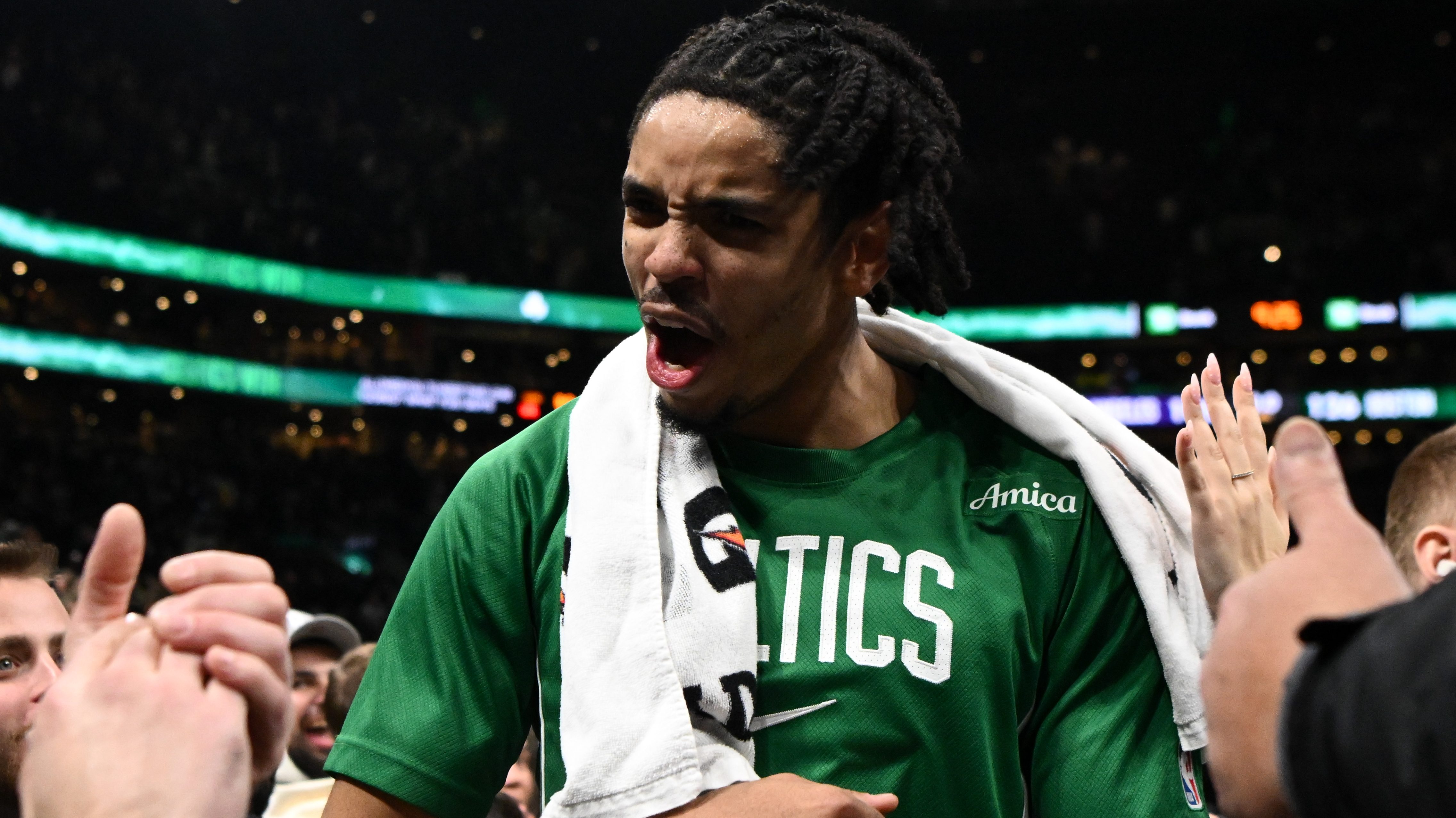 Josh Minott #8 of the Boston Celtics reacts as he walks off of the court after a game against the Los Angeles Lakers at the TD Garden on December 05, 2025 in Boston, Massachusetts.