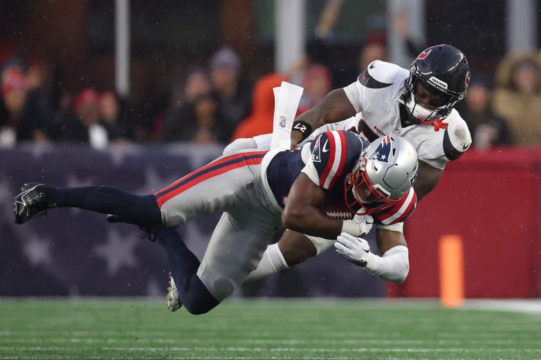 Houston Texans RB Woody Marks tackles New England Patriots DB Craig Woodson