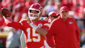 Head coach Andy Reid of the Kansas City Chiefs watches quarterback Patrick Mahomes #15 warm up prior to the game at Arrowhead Stadium on October 19, 2025 in Kansas City, Missouri