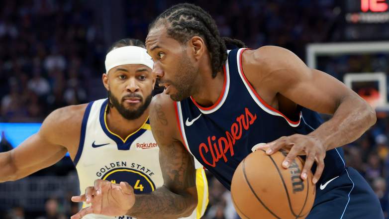 Kawhi Leonard #2 of the LA Clippers is guarded by Moses Moody #4 of the Golden State Warriors