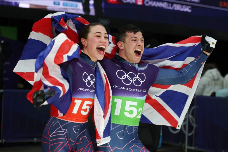 The mixed-team pair from Great Britain after they won the gold medal in skeleton at the 2026 Winter Olympics in Milan-Cortina