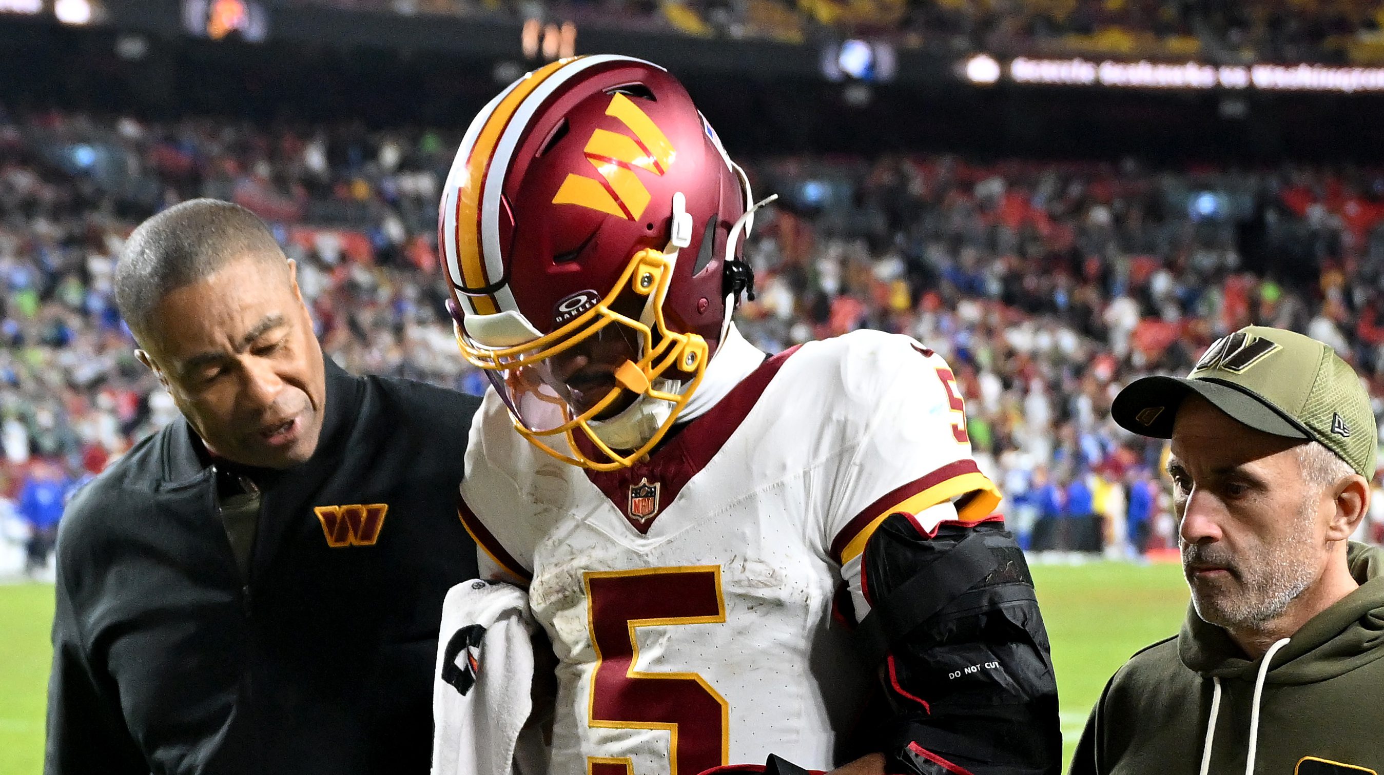 Analysts question Commanders QB Jayden Daniels’ durability after early hits.
