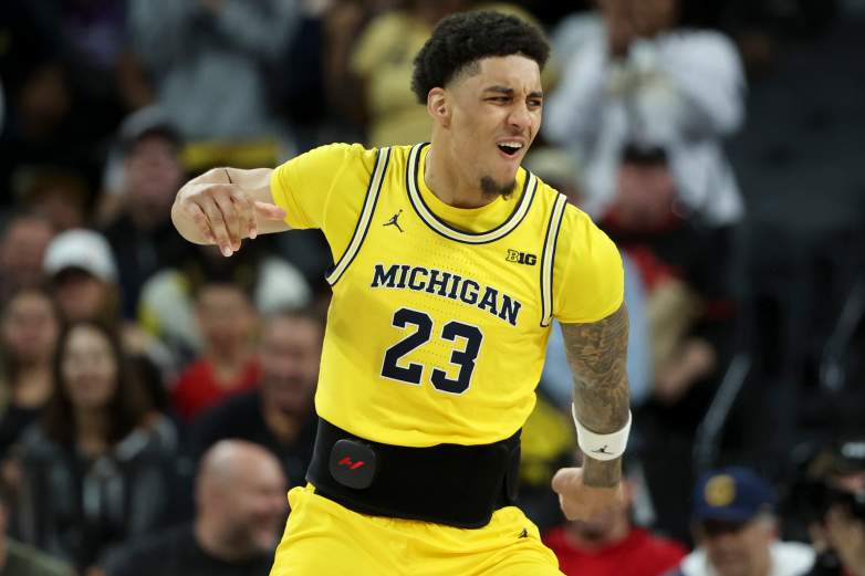 Michigan claims No. 1 in the AP Top 25 NCAA Men's College Basketball poll for the first time since 2013. Plus the biggest risers, fallers, a bench-clearing brawl, and must-watch games this week as March Madness inches closer.