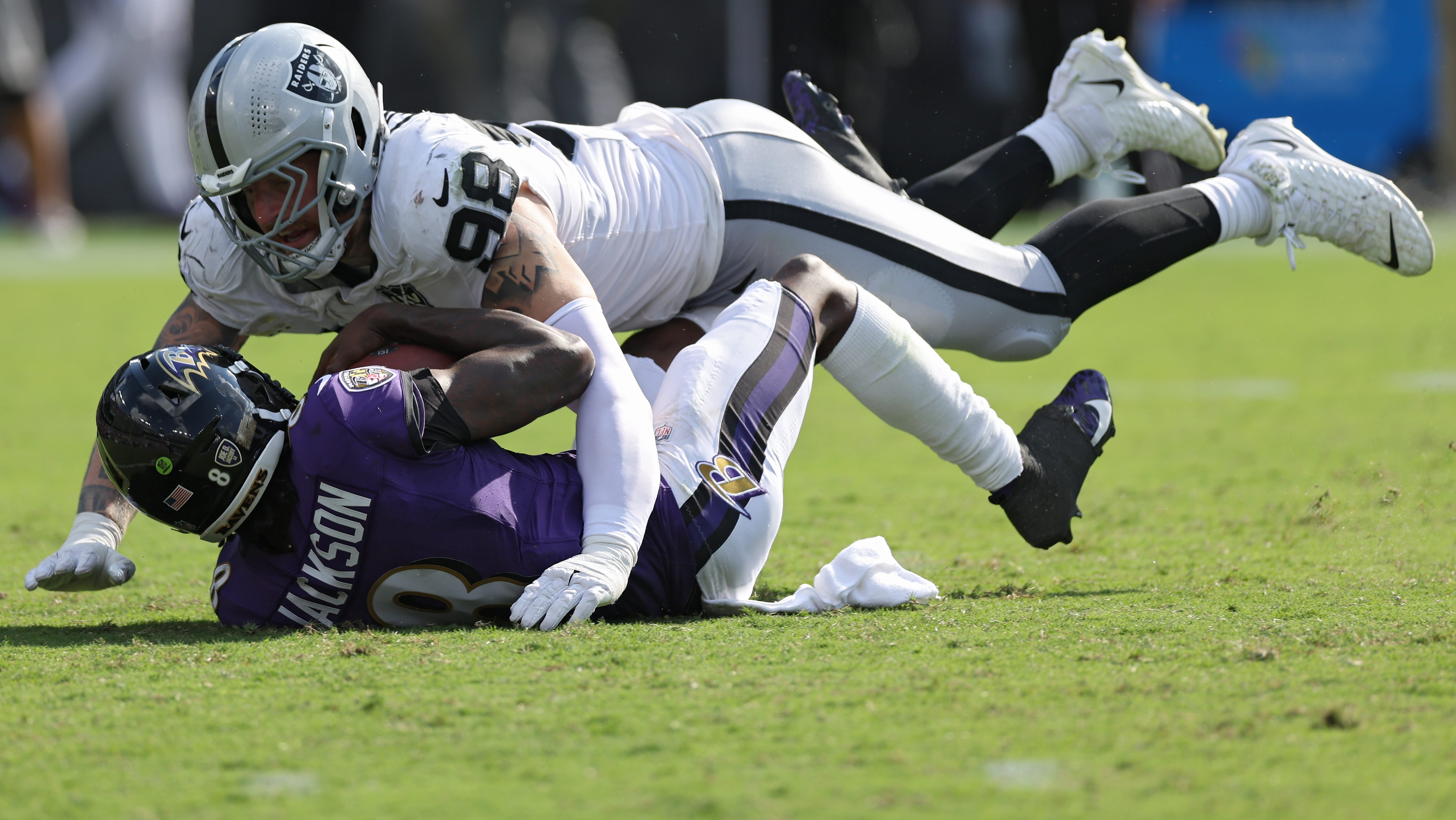 Maxx Crosby and Lamar Jackson