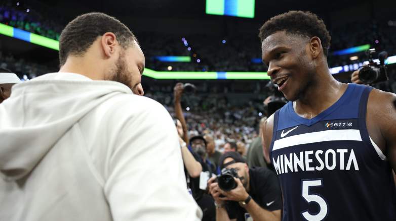 Stephen Curry of the Golden State Warriors congratulates Anthony Edwards