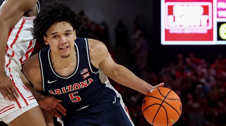 Arizona guard Brayden Burries drives during a college basketball game.