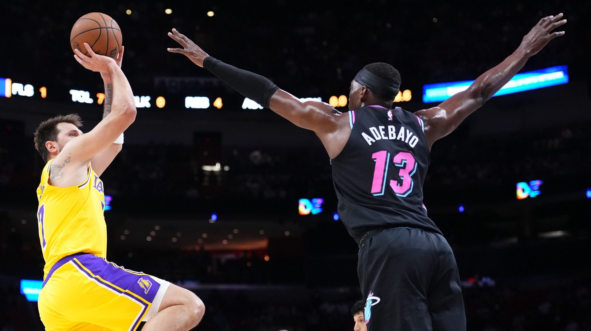 Luka Doncic of the Los Angeles Lakers goes up for a shot against Bam Adebayo of the Miami Heat.
