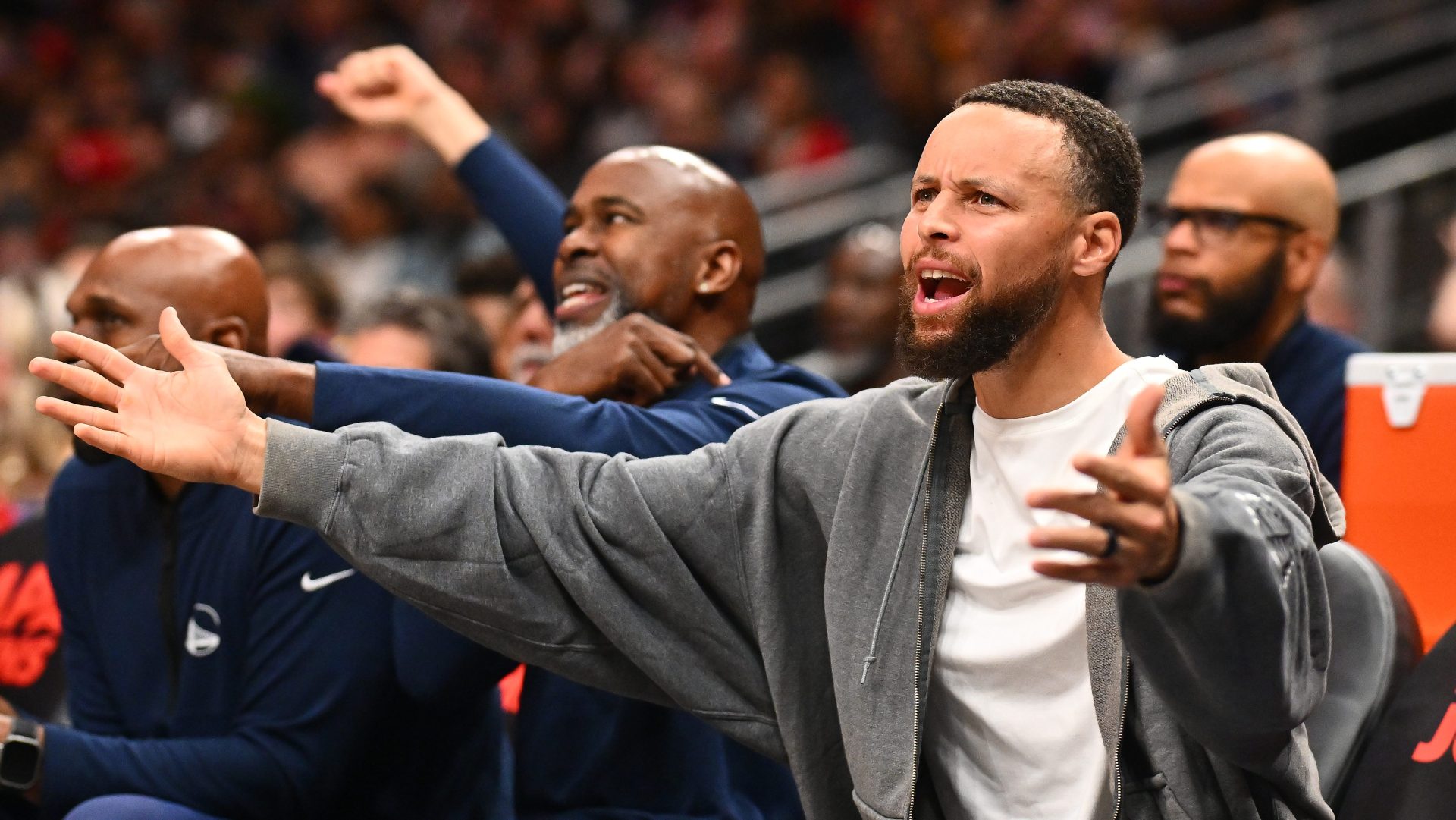 Stephen Curry of the Golden State Warriors reacts from the bench.