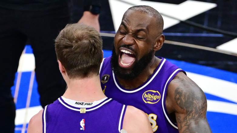 LeBron James celebrates with Luke Kennard of the Los Angeles Lakers