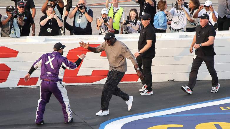 Michael Jordan greeting NASCAR Tyler Reddick after race win.
