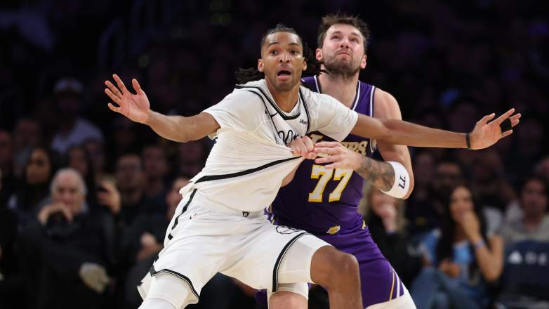 Luka Dončić and Ziaire Williams battle for position during Lakers vs Nets game