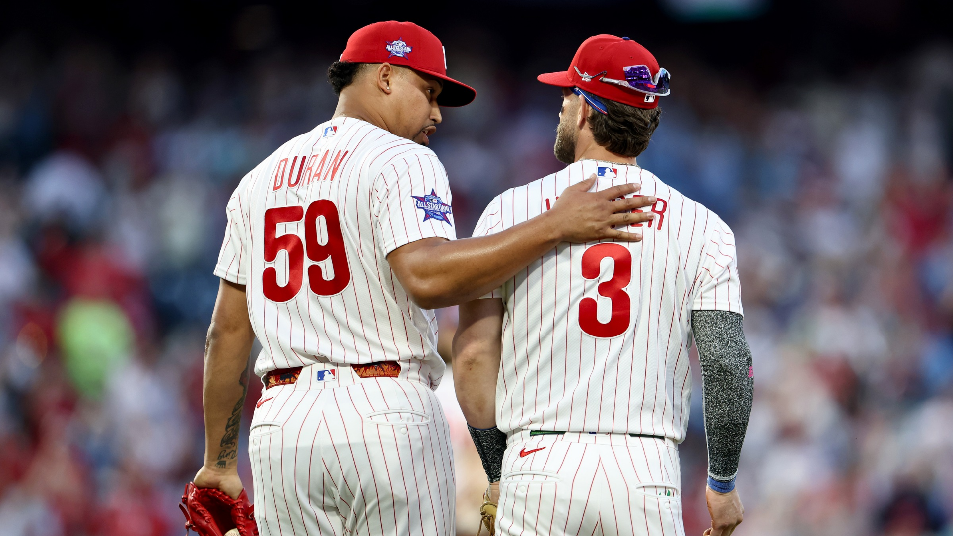 Jhoan Duran #59 and Bryce Harper #3 of the Philadelphia Phillies celebrate a 5-3 win over the Texas Rangers on Opening Day at Citizens Bank Park on March 26, 2026 in Philadelphia, Pennsylvania. (Photo by Emilee Chinn/Getty Images)