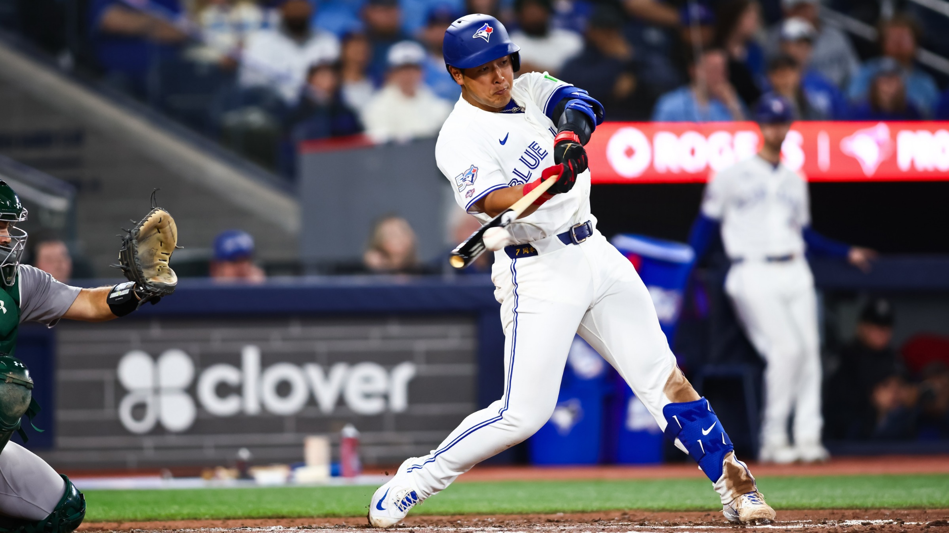 Kazuma Okamoto #7 of the Toronto Blue Jays hits a single in the ninth inning of their MLB game against the Athletics at Rogers Centre on March 27, 2026 in Toronto, Ontario, Canada. (Photo by Cole Burston/Getty Images)