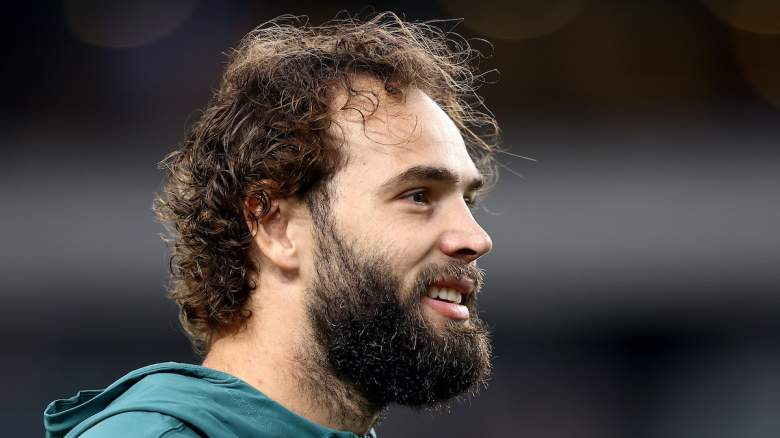Eagles tight end Dallas Goedert watches from the sidelines.