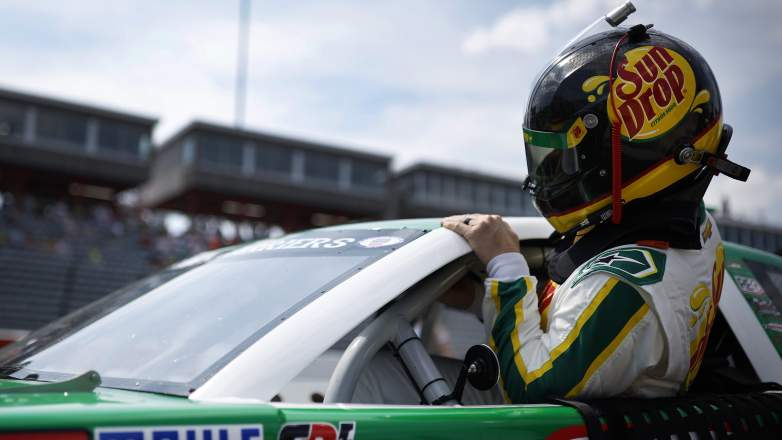 Dale Earnhardt Jr climbs into his car during CARS Tour qualifying at North Wilkesboro Speedway