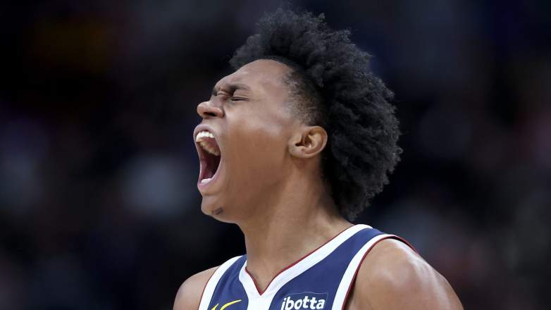 Peyton Watson reacts on the bench during Nuggets playoff game while sidelined with injury