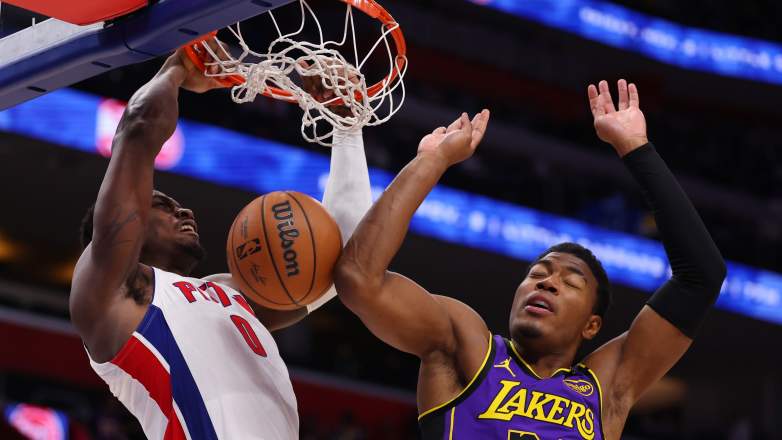 Jalen Duren of the Detroit Pistons dunks the ball against Rui Hachimura of the Los Angeles Lakers.