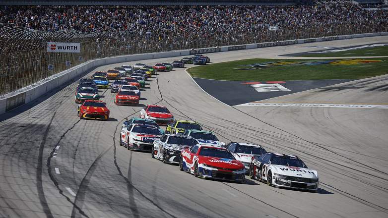 NASCAR Cup Series cars racing in a pack at Texas Motor Speedway during Würth 400