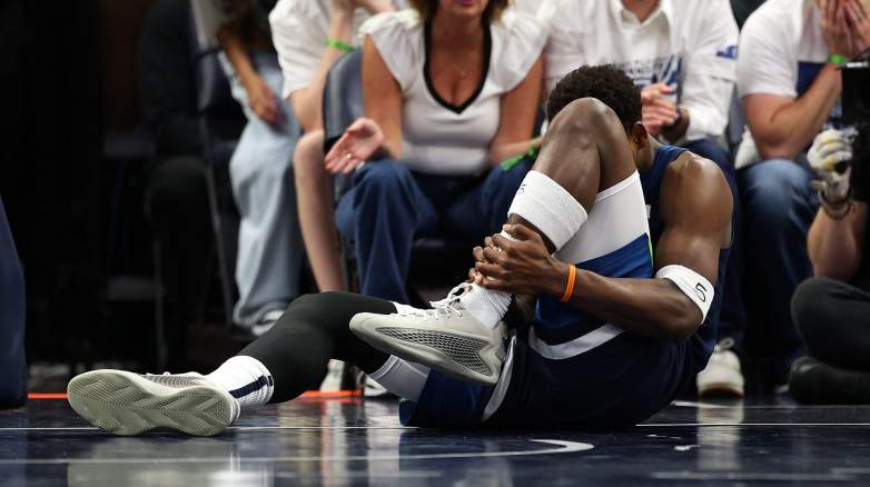 Anthony Edwards reacts while dealing with discomfort during Timberwolves game