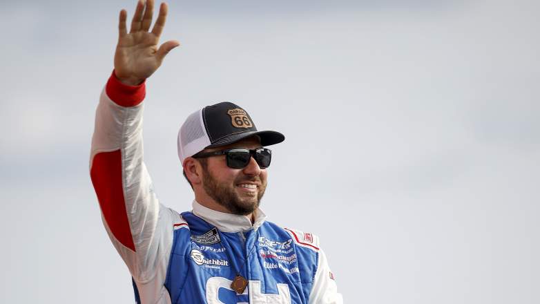 Chad Finchum driver of the No. 66 Ford waves to fans before NASCAR Cup Series race