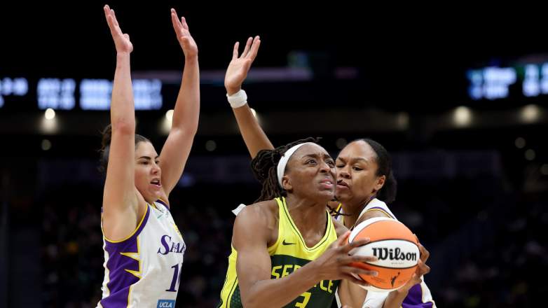 Nneka Ogwumike of the Seattle Storm drives to the hoop against Kelsey Plum of the Los Angeles Sparks