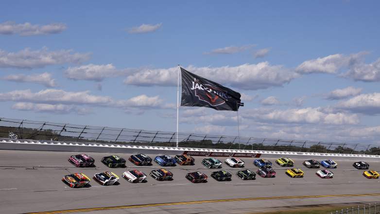 Cars race in a pack at Talladega Superspeedway during a NASCAR Cup Series event