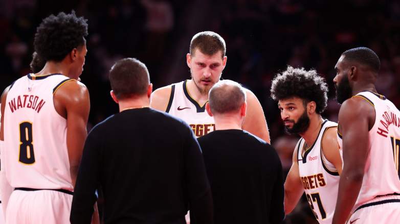 Peyton Watson with Nikola Jokic and Nuggets teammates during game huddle before playoffs