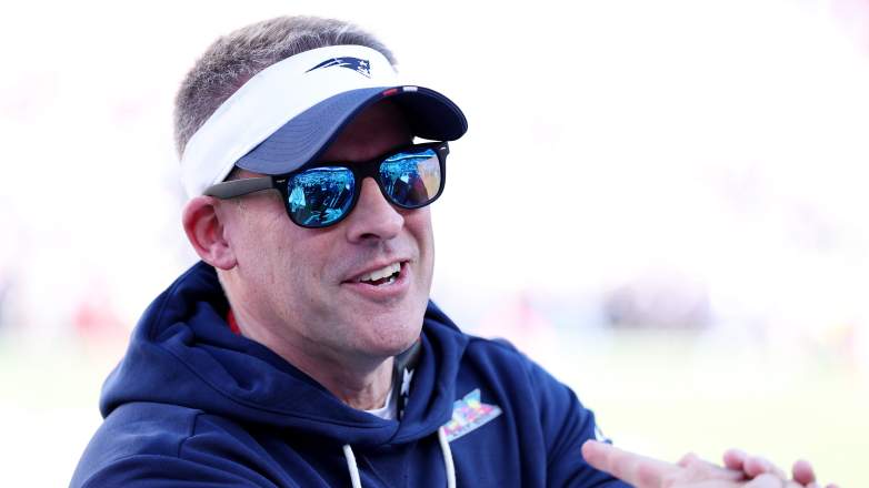 New England Patriots offensive coordinator Josh McDaniels wearing sunglasses and a visor before Super Bowl LX.