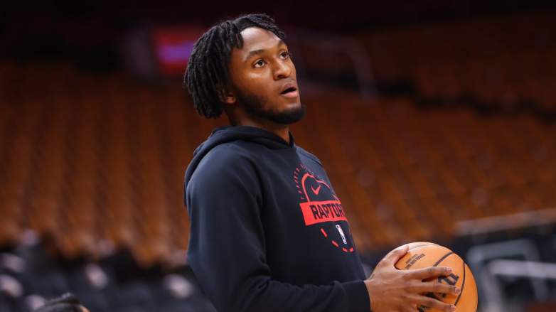 Toronto Raptors guard Immanuel Quickley warms up before a game. Quickley is day-to-day with a hamstring injury following MRI results ahead of the Raptors vs Cavaliers playoff series.