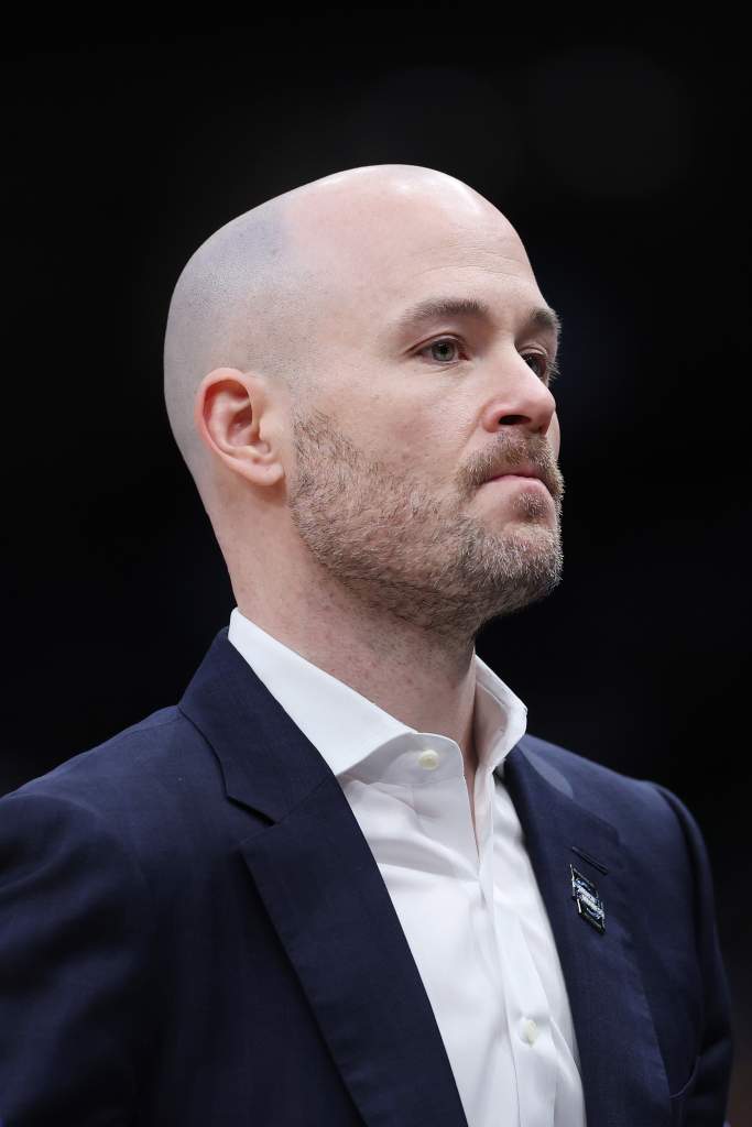 UConn assistant coach Luke Murray during a college basketball game.