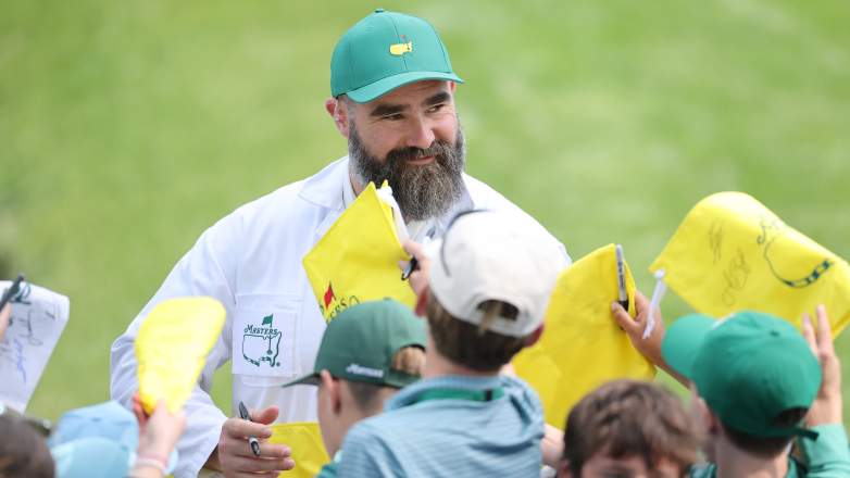 Jason Kelce signing autographs for fans during the Masters Par 3 Contest at Augusta National