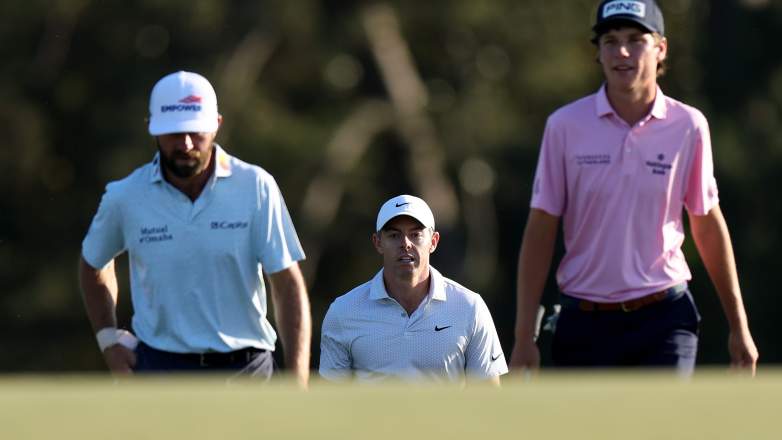 Rory McIlroy and Cameron Young shake hands on the 18th green during the first round of the 2026 Masters