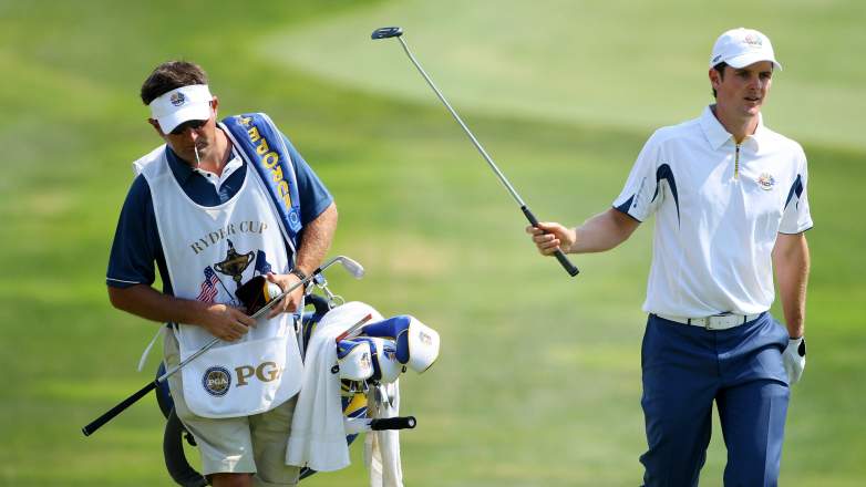 Justin Rose hands a club to caddie Mark âFoochâ Fulcher during the 2008 Ryder Cup at Valhalla Golf Club